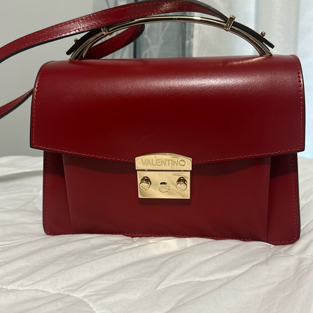 Hot red color Mario Valentino bag.